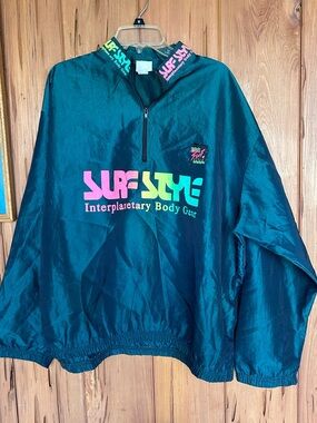 surf style Teal Windbreaker Pullover with Neon Pink and Neon Green Logo